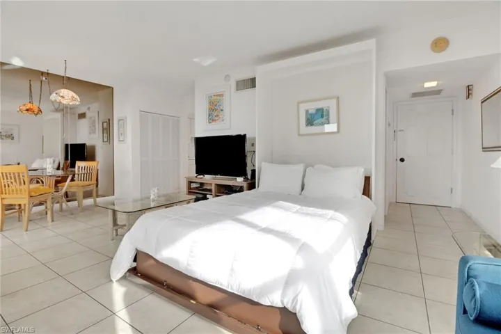 Bedroom with light tile patterned floors