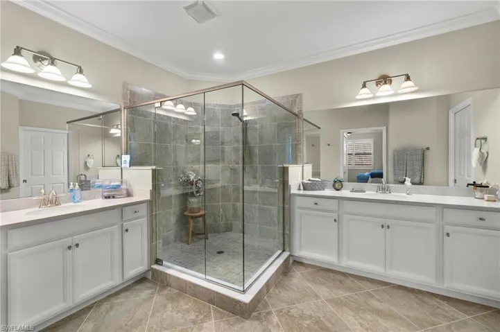 Walk-in shower with split, dual sinks