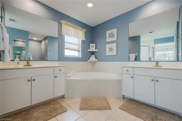 Separate soaking tub and shower, dual sinks, walk in closet.