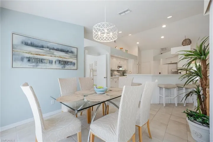 Formal dining room with view of pool