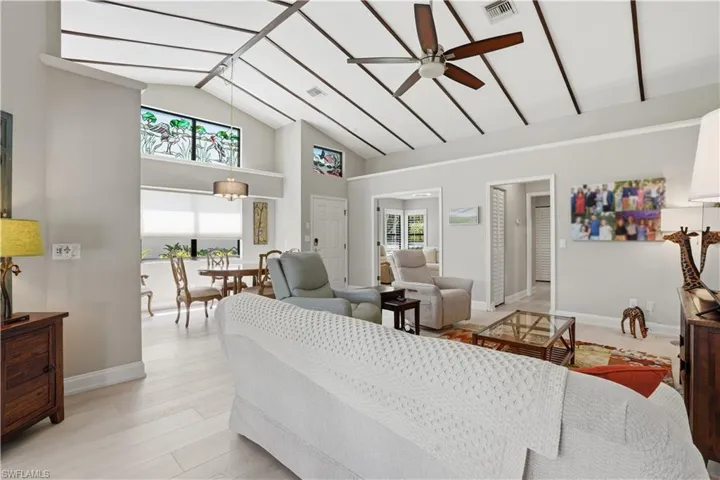 Notice the ceiling detail and custom stained-glass windows.