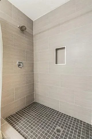 Bathroom with a tile shower