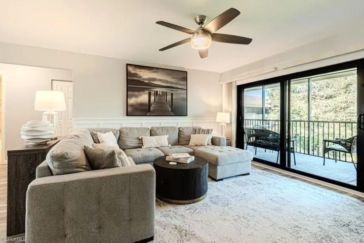 Living room featuring ceiling fan