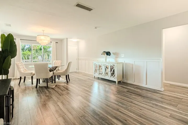 Dining room featuring a chandelier and hardwood / wood-style floors