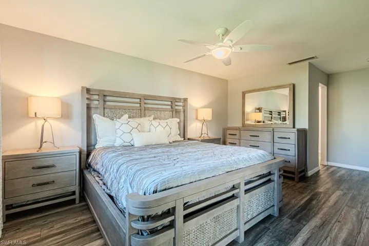Bedroom featuring dark wood-type flooring and ceiling fan