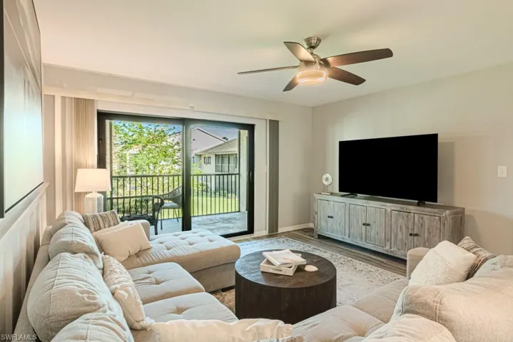 Living room featuring light hardwood / wood-style floors and ceiling fan
