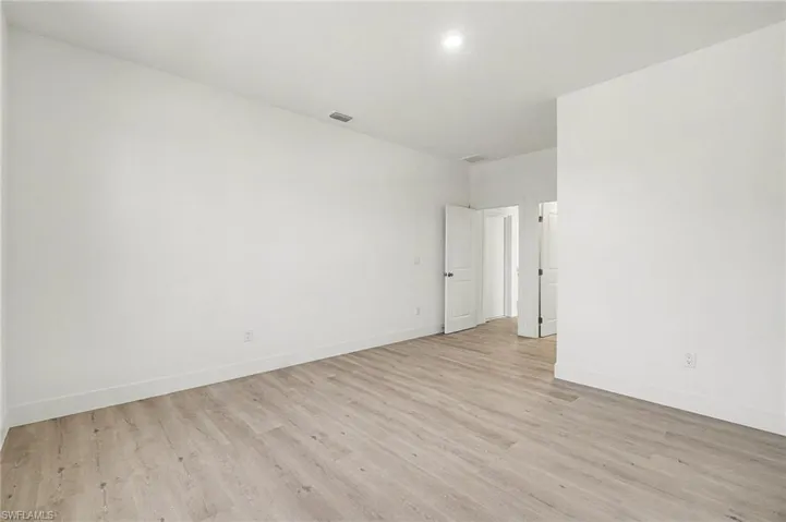 Empty room featuring light wood-style flooring and baseboards