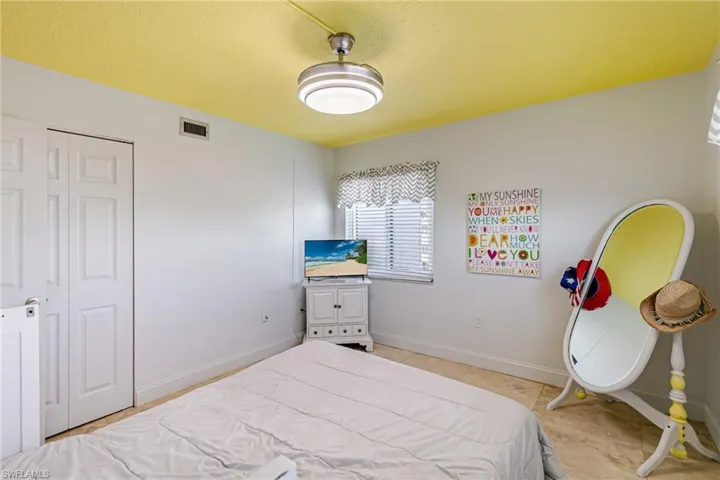 Bedroom with baseboards and a closet