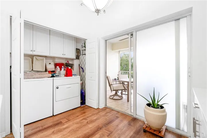 Washer and dryer plus storage space.