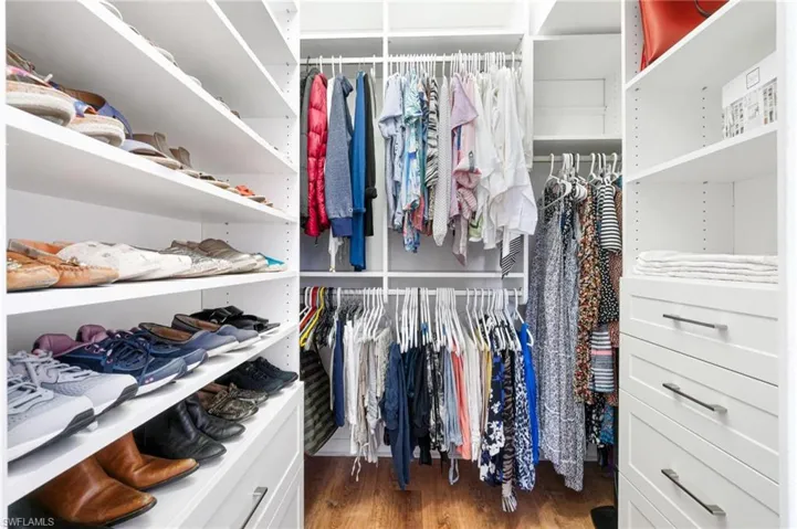 spacious, NEWER closet system in the primary bedroom was completed by Inspired Closets (Dec. 2023).