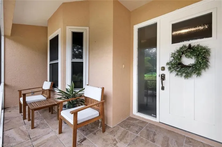 Elegant front entryway features an additional lanai.