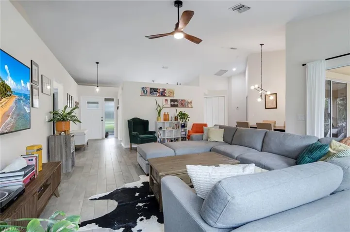 View of entryway from living room. Primary suite is located just off the main living area.