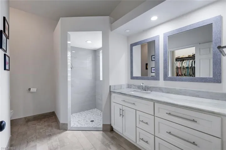En suite primary bathroom has been beautifully updated.
