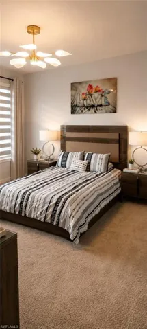 Bedroom featuring a wood-finish headboard, light-toned carpeting, window with horizontal blinds, overhead ceiling light fixture, and neutral wall tones