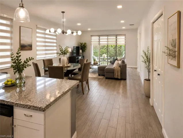 Open-concept living space with plank-style flooring throughout