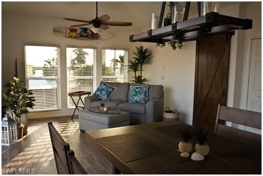 Rear view of property featuring a patio area, a deck, and stairs