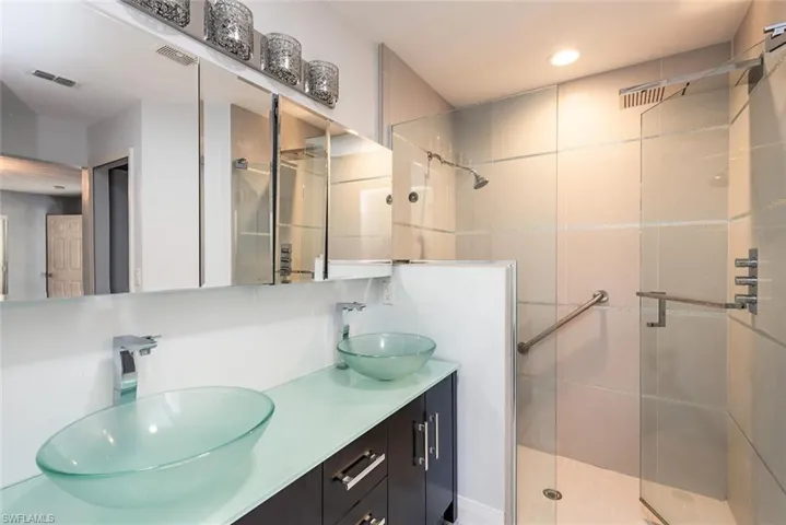 Bathroom featuring vanity and walk in shower