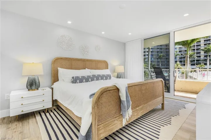 Bedroom featuring access to exterior and light wood-type flooring