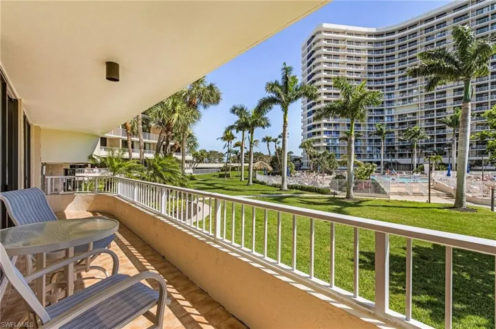 Balcony featuring a community pool