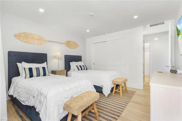 Bedroom with a closet and light wood-type flooring