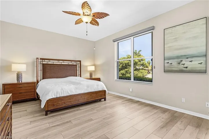 Recessed lighting, wood-finish flooring, and a ceiling fan with light fixture