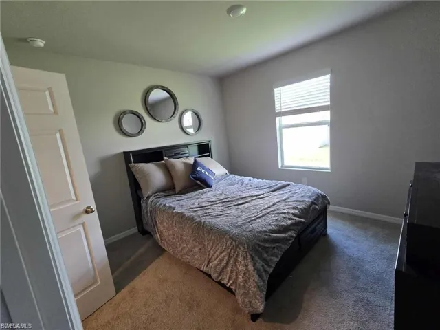 Bedroom featuring carpet flooring