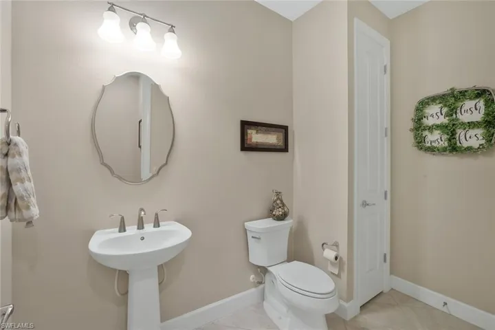 Bathroom with sink, tile patterned floors, and toilet