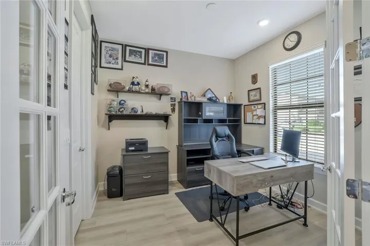 Home office with light wood-type flooring