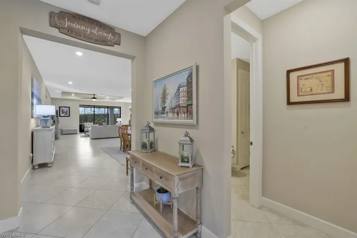 Corridor featuring light tile patterned floors
