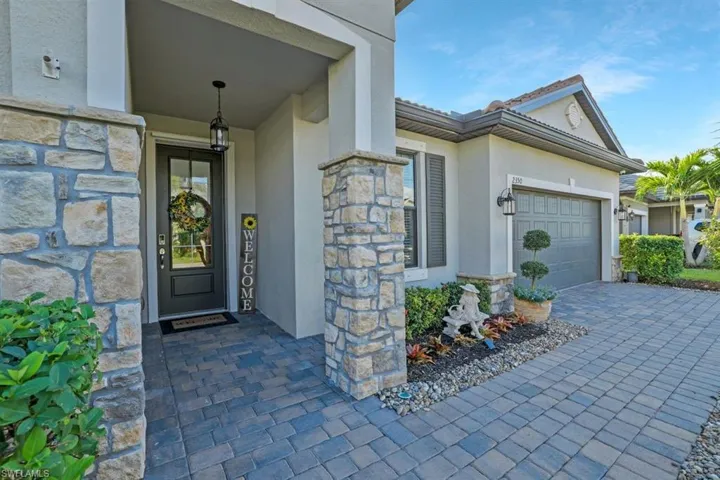 Entrance to property with a garage