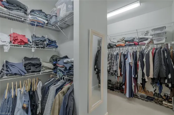 Walk in closet featuring carpet flooring