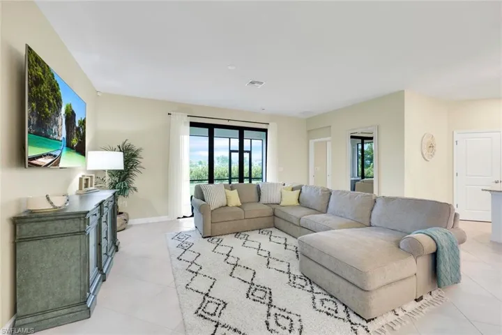Living room with light tile patterned floors