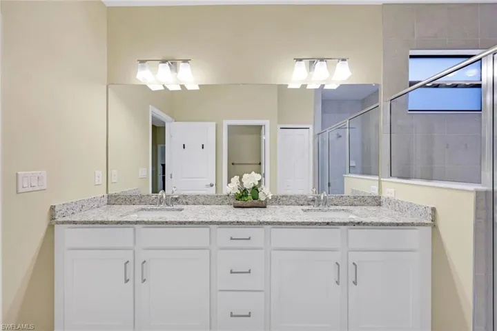 Bathroom with vanity and walk in shower