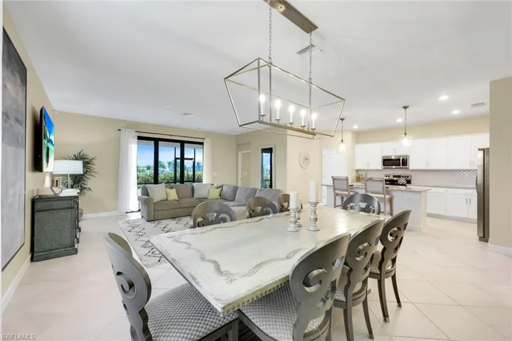 Dining space with light tile patterned floors