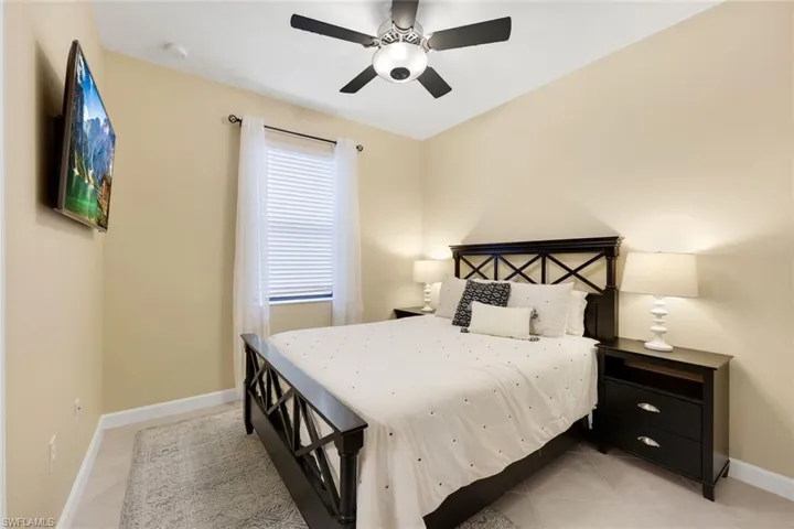 Tiled bedroom with ceiling fan