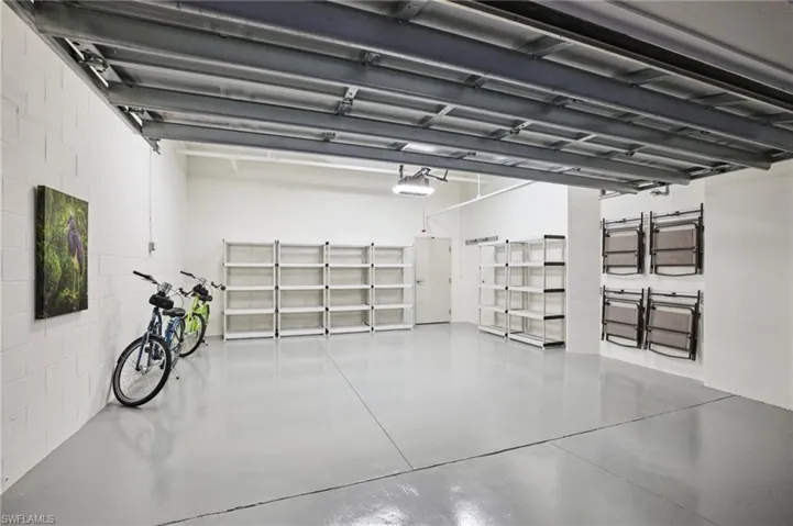Garage featuring concrete block wall
