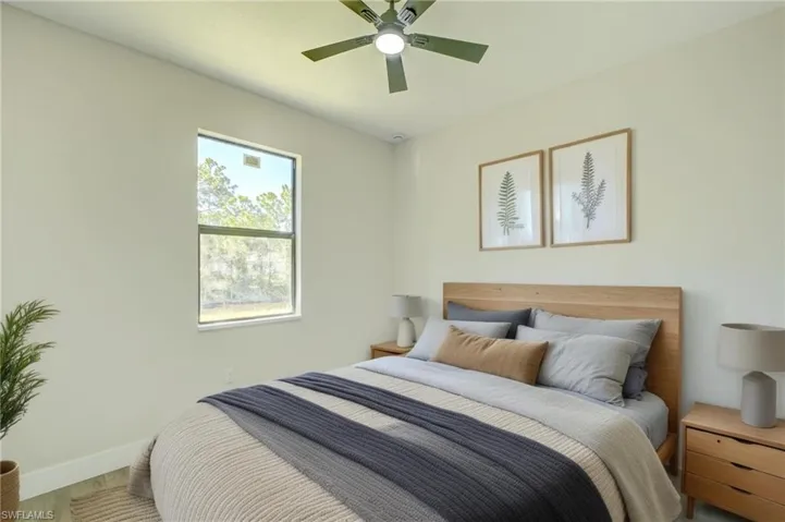 Virtual Stage - Bedroom with a ceiling fan and wood finished floors