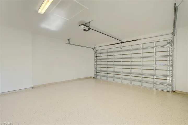 Spare room featuring a tray ceiling, light wood-style floors, recessed lighting, and ceiling fan