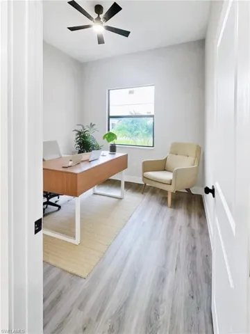 Virtual Stage - Office with light wood-style flooring and ceiling fan
