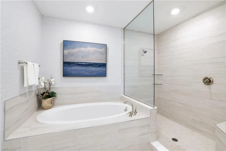 Bathroom featuring a garden tub and walk in shower