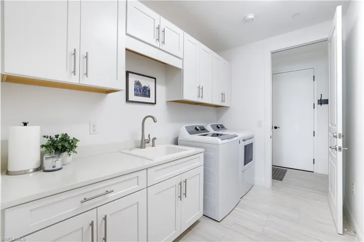 Laundry room featuring cabinet space and washing machine and dryer