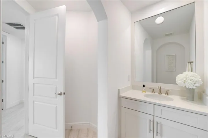 Bathroom with vanity and baseboards