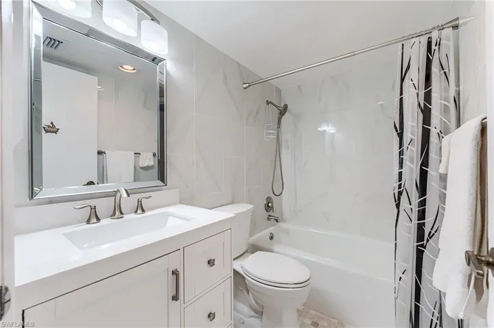 Guest BathroomBrand new cabinetry, Kohler toilet, fixtures and lightingcountertops, tile,
