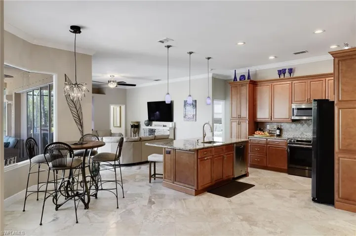 kitchen with breakfast nook on the left looking into the living area.