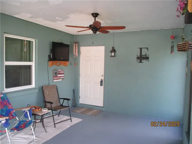 Entrance to kitchen, screened in carport/lanai