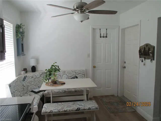 Dining space with breakfast area and wood finished floors