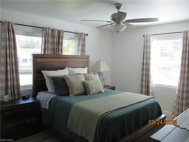 Primary bedroom featuring a ceiling fan