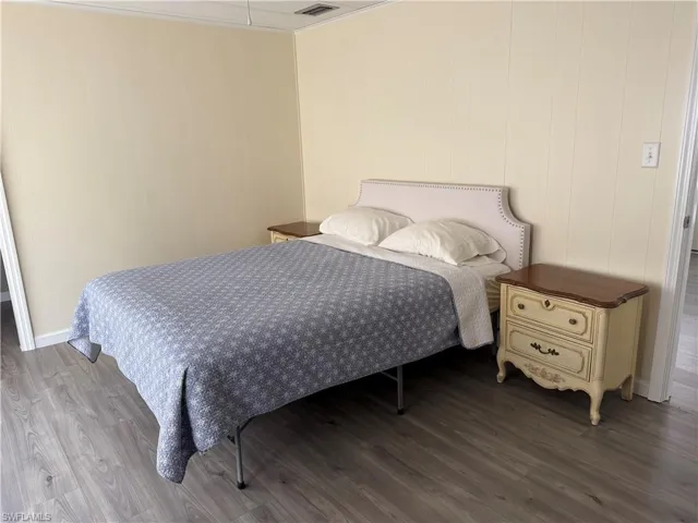 Bedroom featuring wood-type flooring