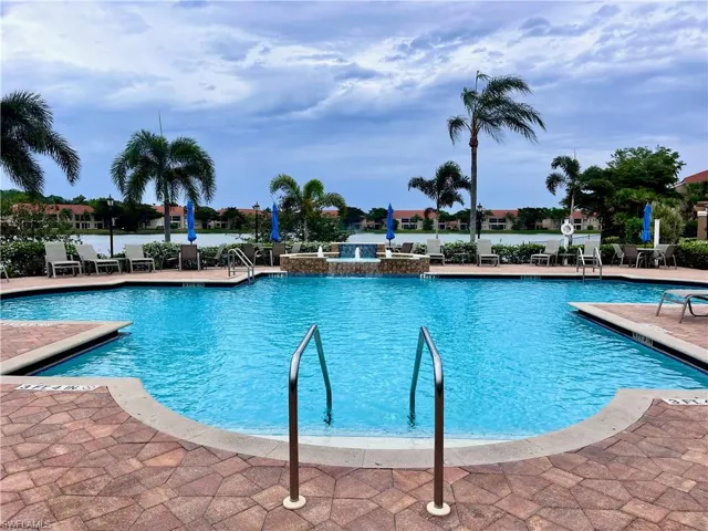 Community pool featuring a patio area