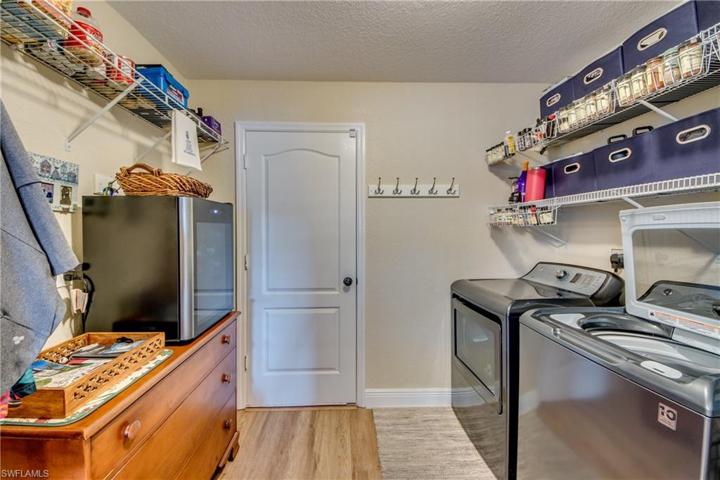 Massive laundry room with plenty of storage and shelving space